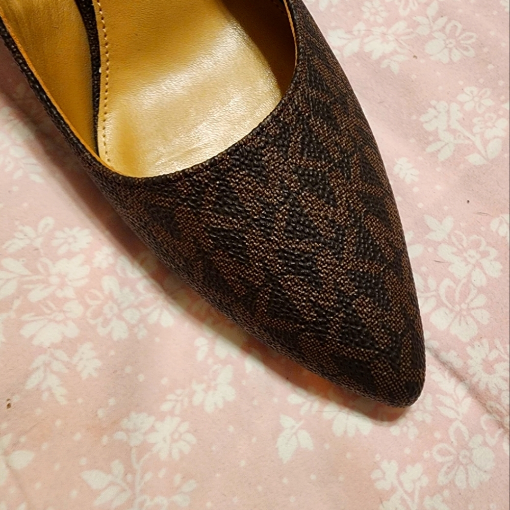 Signature Michael Kors brown heels.